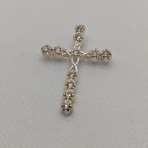 Elegant Gold and Silver Cross Pendant